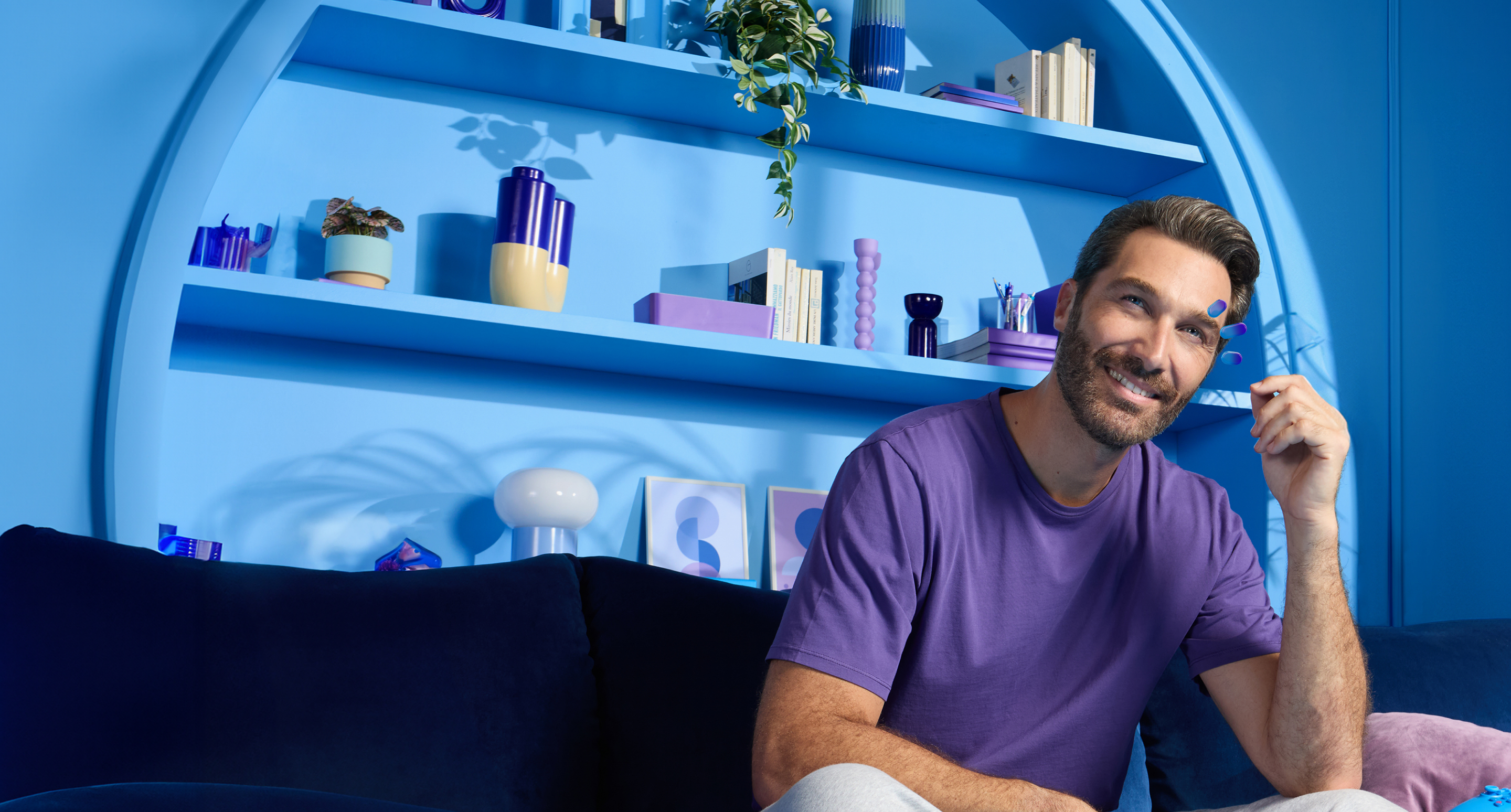 A male Miebo user in a purple shirt looking to his right